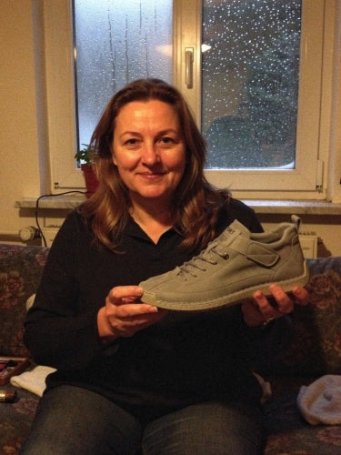 Montela customer holding her shoes