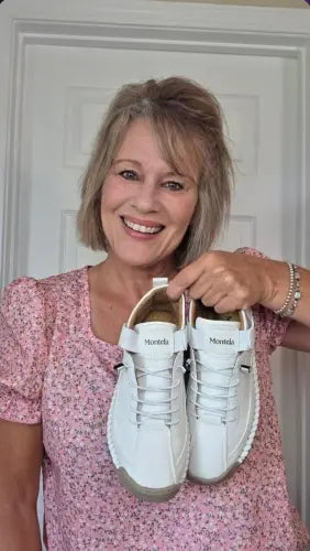 Happy Montela customer holding her shoes